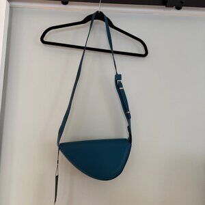 NWT BCBG MaxAzria moon shaped cross-body purse in Teal with gun-metal hardware